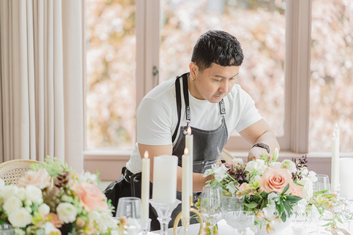 Jay styling a wedding tablescape